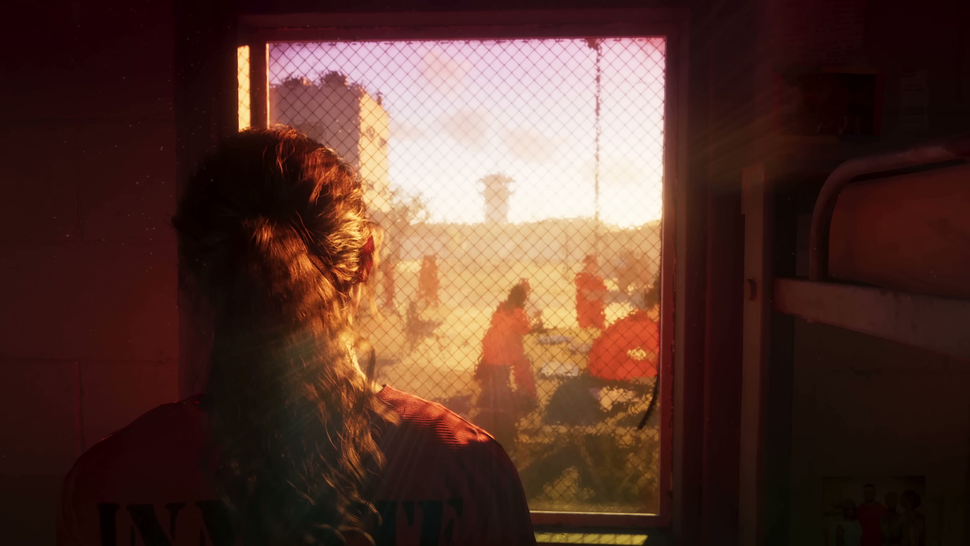 Lucia in an orange inmate shirt looking out from a prison cell window
