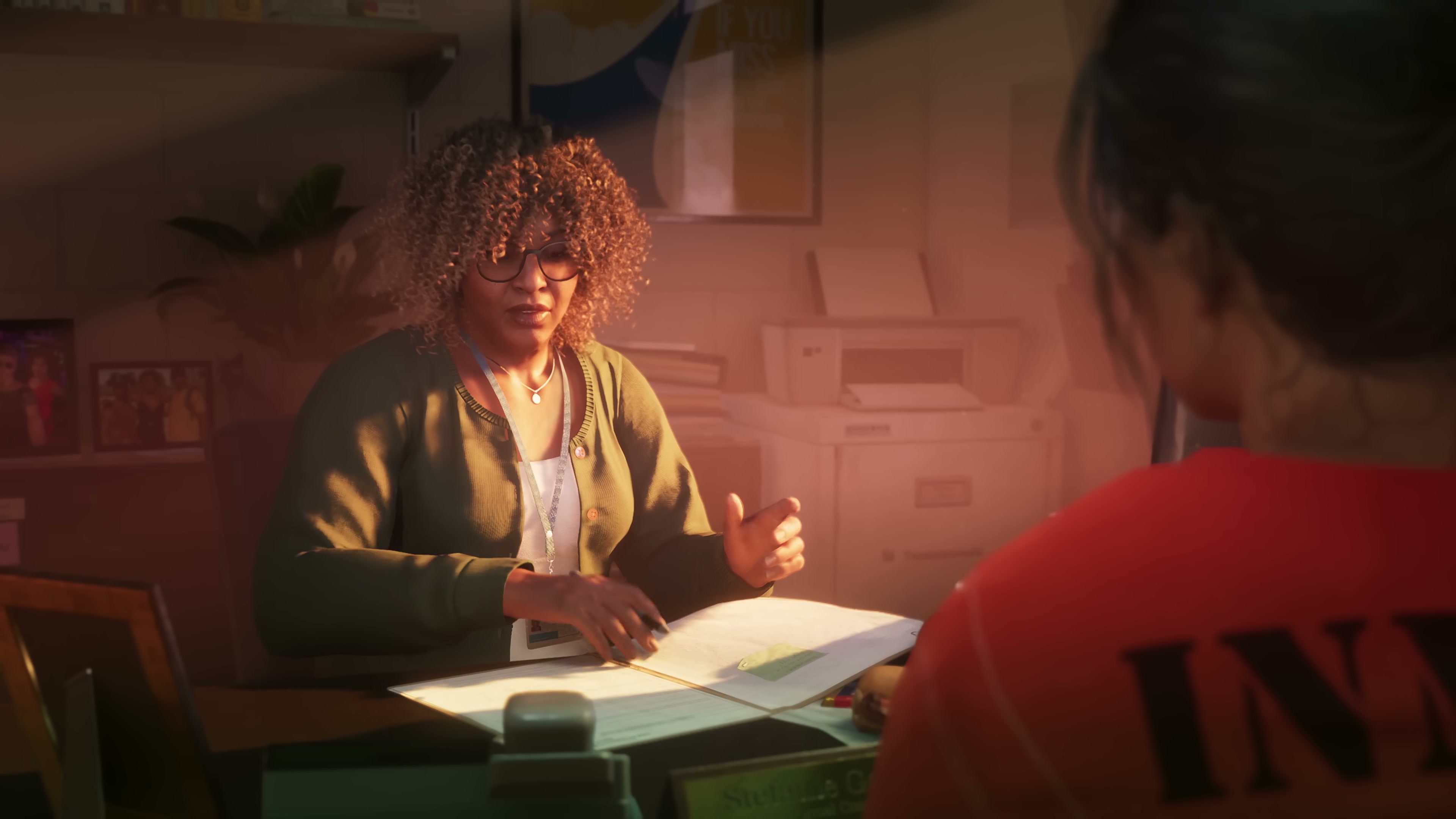 Lucia seated across from a parole officer in a warmly lit office