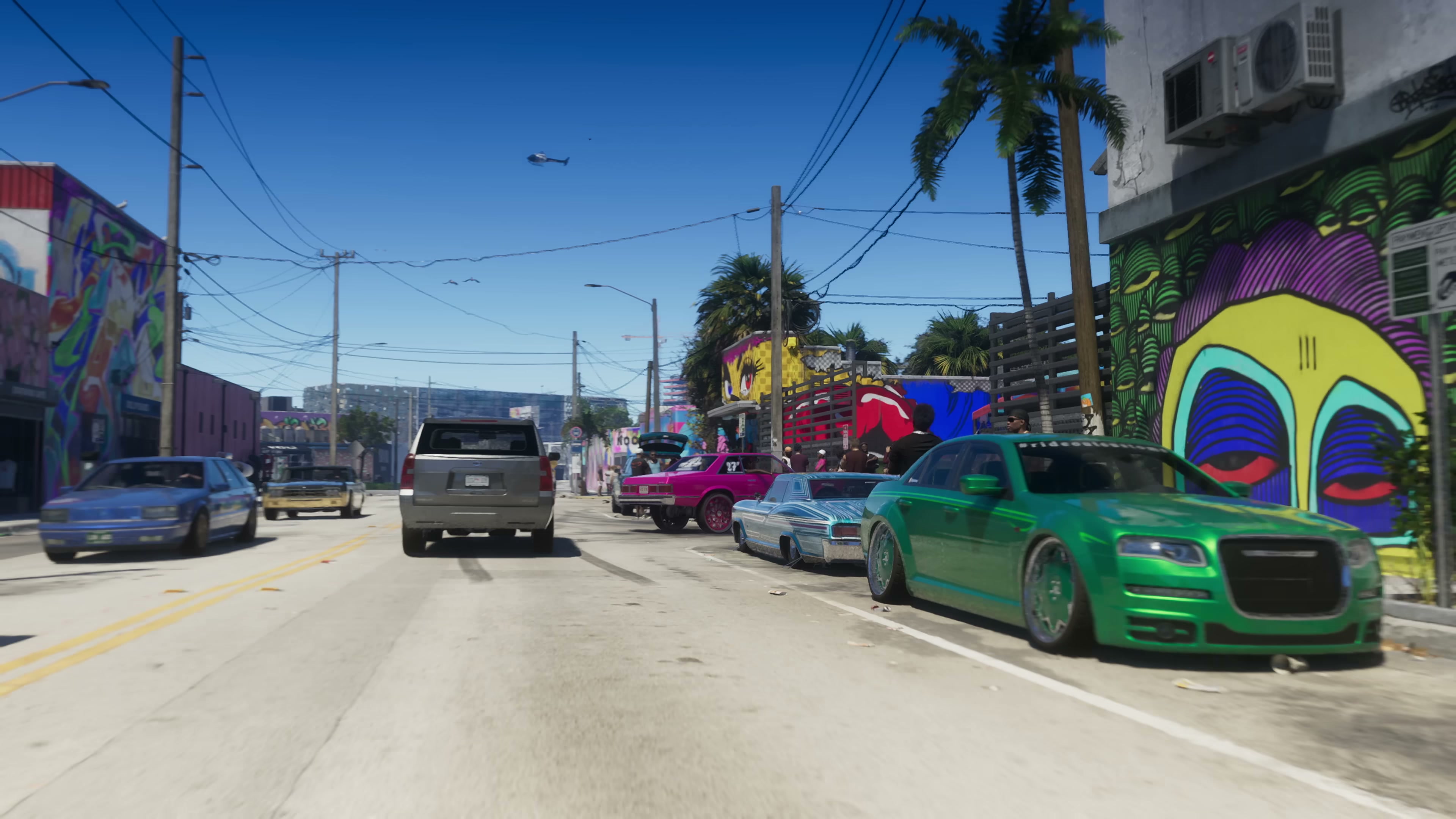 Urban Vice City street with palm trees, parked sedans, an SUV driving ahead, and a helicopter overhead