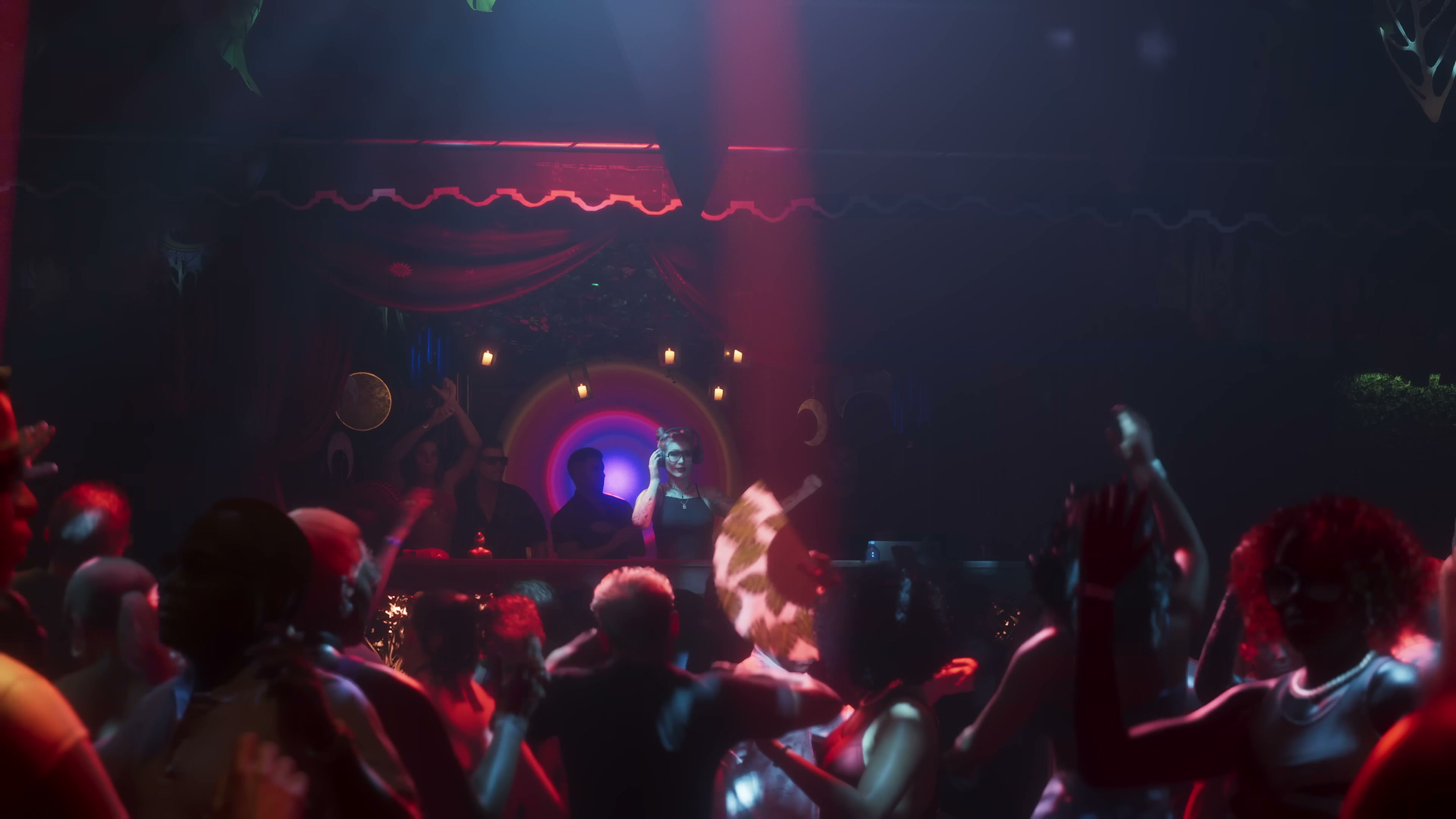Crowded nightclub interior with a female DJ and dancing patrons under red neon lighting